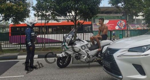 Almost naked man stares down LTA officer from stationery motorbike at Jurong West