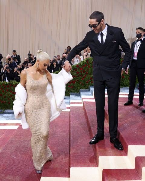 Kim Kardashian struggles up Met Gala stairs wearing Marilyn Monroe’s too-tight dress