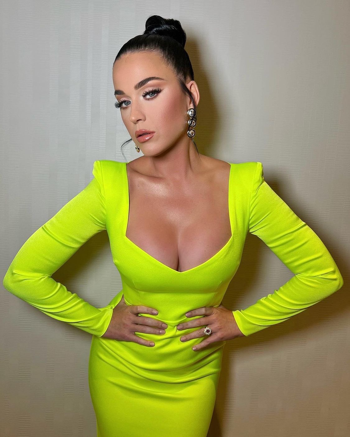 Katy Perry shows off in skintight neon dress as she shares her excitement about getting keys to Vegas